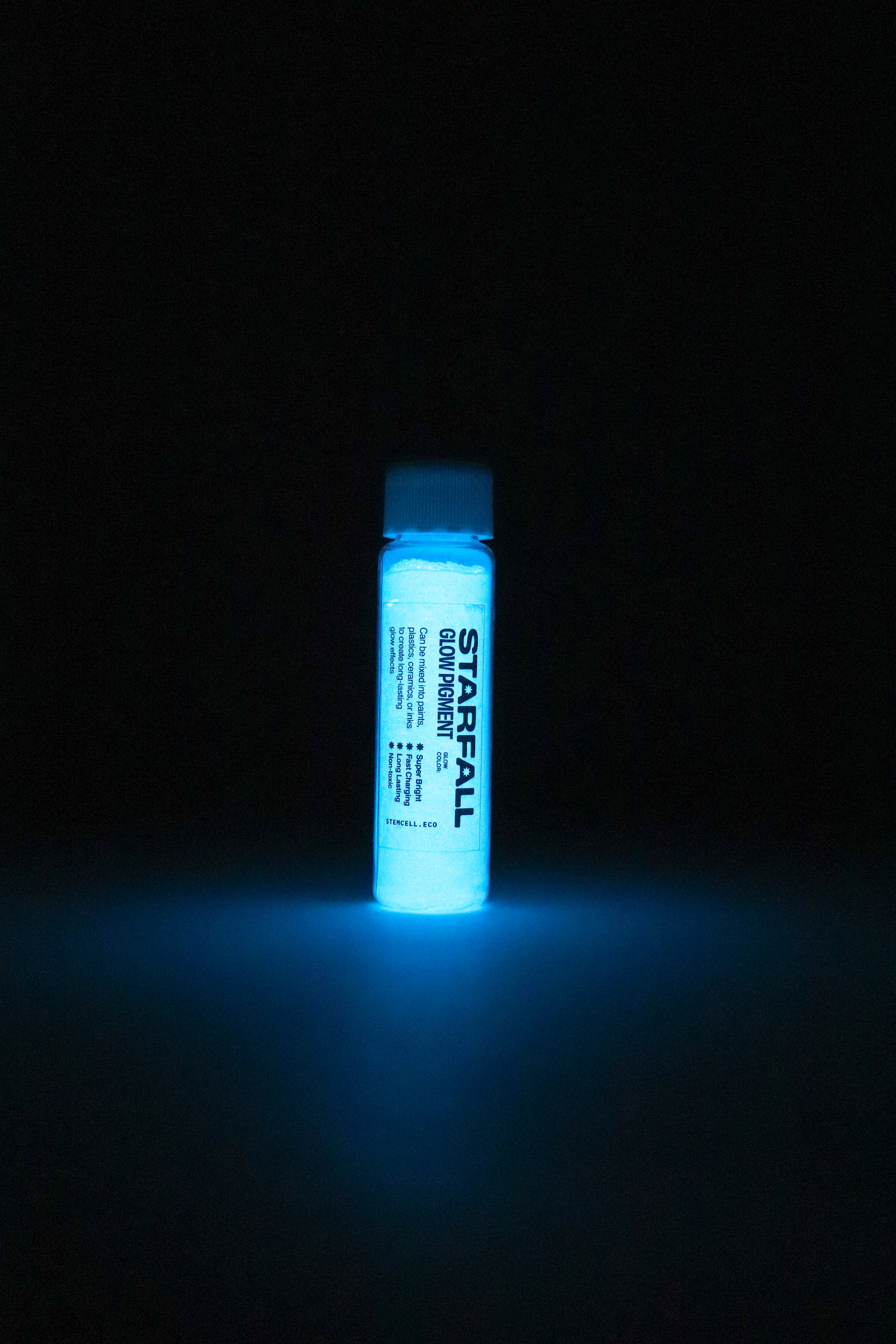 Blue glowing bottle labeled 'Starfall' against a black background