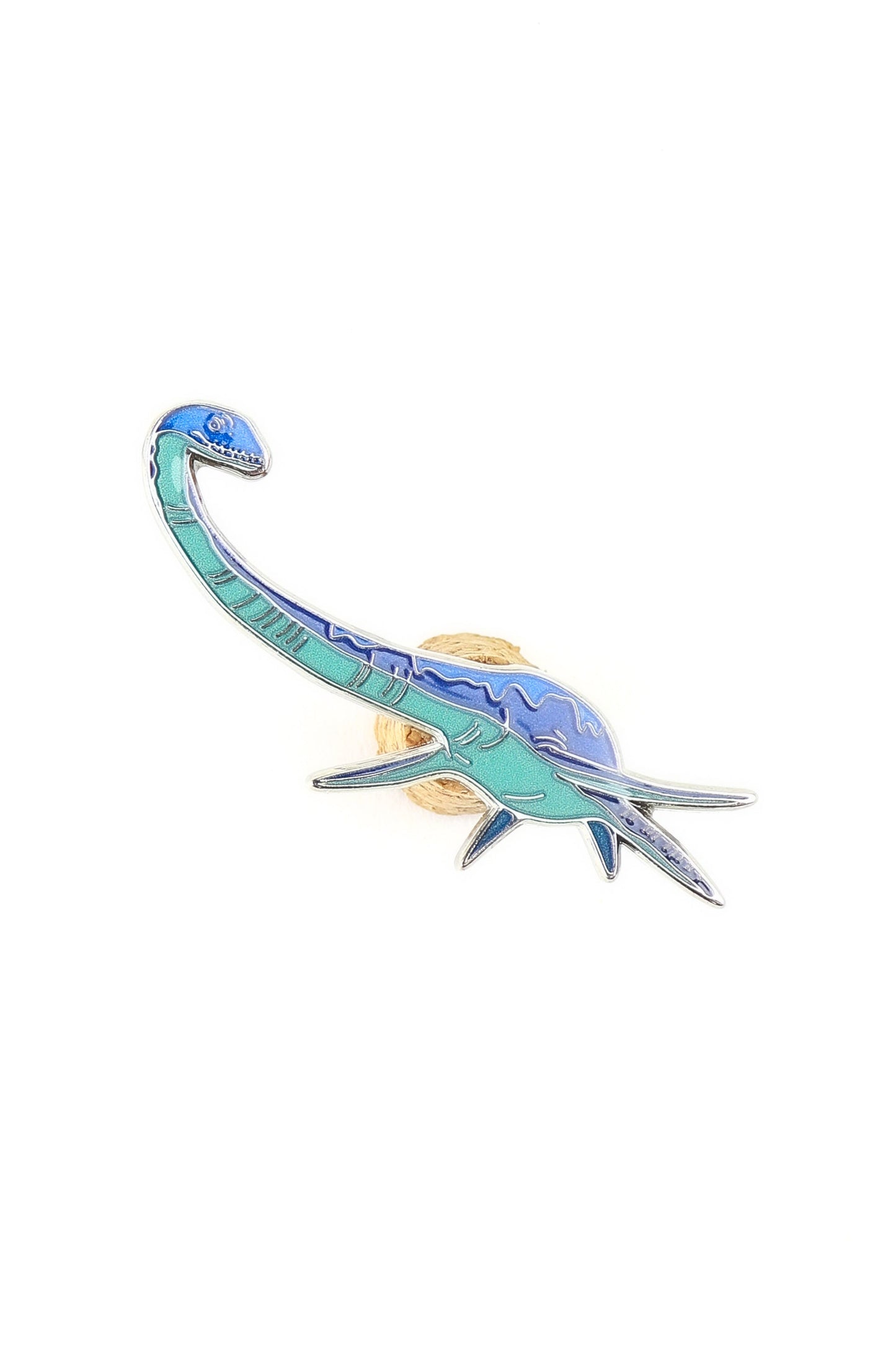 Dinosaur-shaped hair clip on a white background