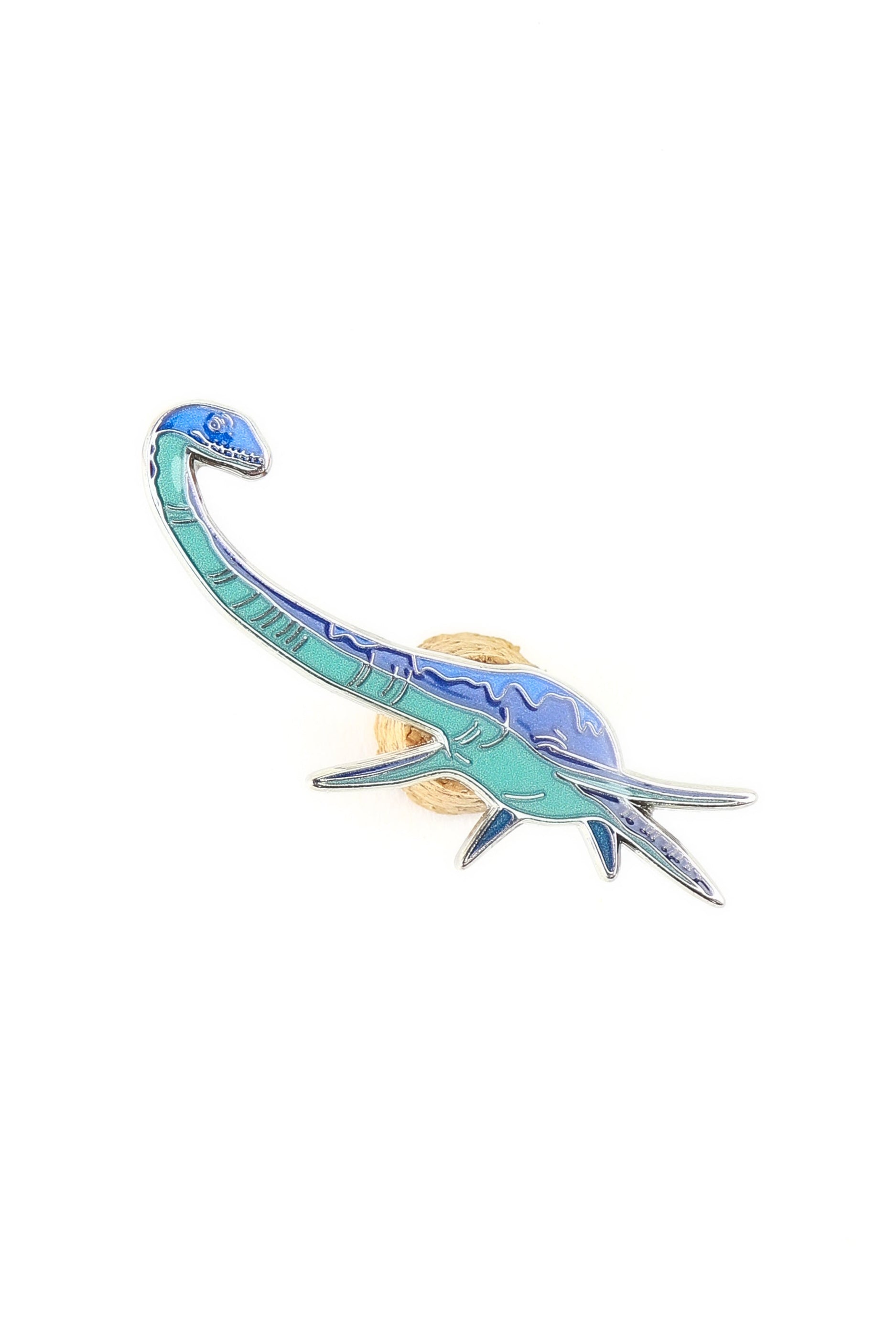 Dinosaur-shaped hair clip on a white background