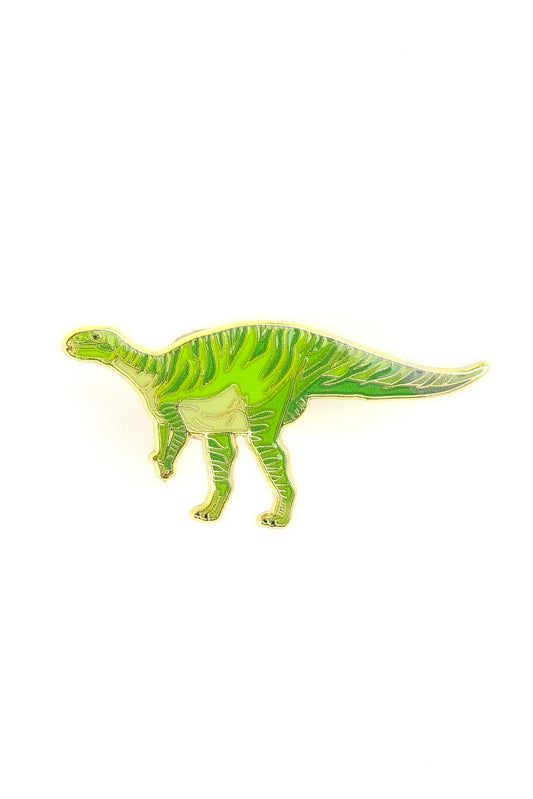 Green dinosaur toy figure on a white background