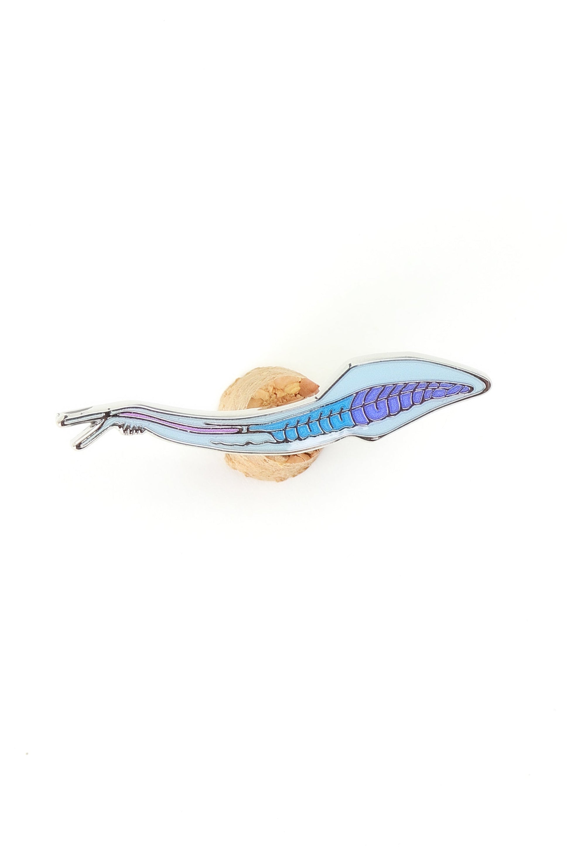 Toy snake with a blue body and brown head on a white background