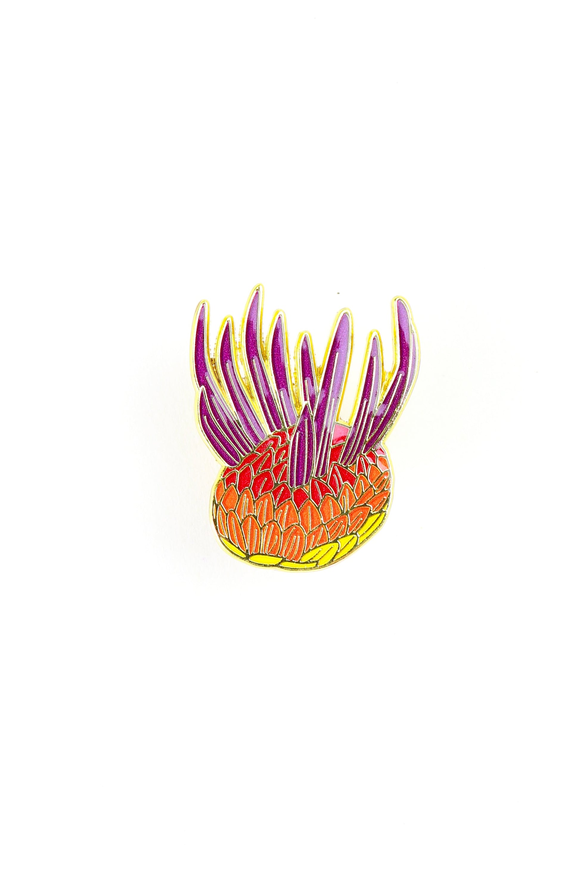 Colorful glass sculpture with tentacle-like extensions on a white background